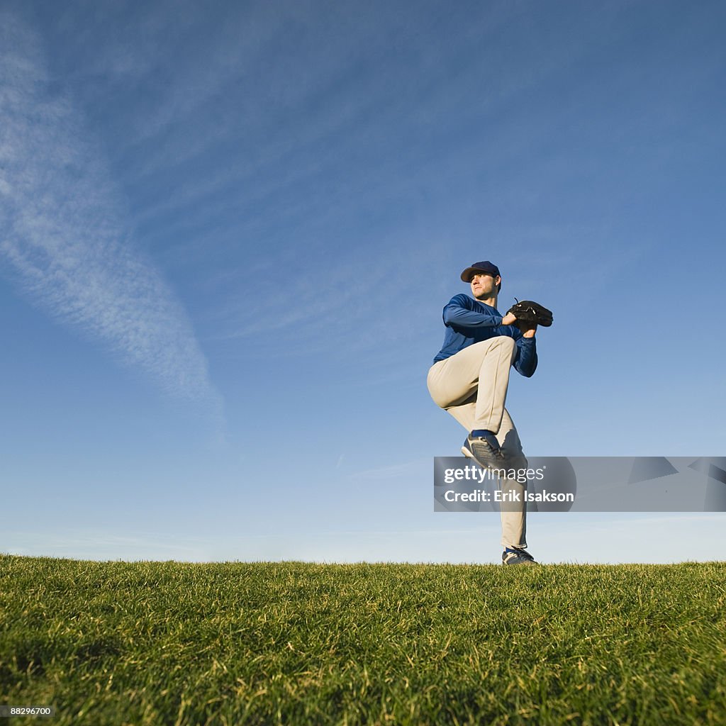 Baseball player throwing ball