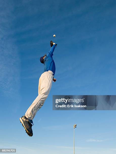 baseball player catching ball - baseball player stock pictures, royalty-free photos & images