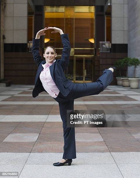 businesswoman dancing in urban setting - arts express yourself 2009 stock pictures, royalty-free photos & images