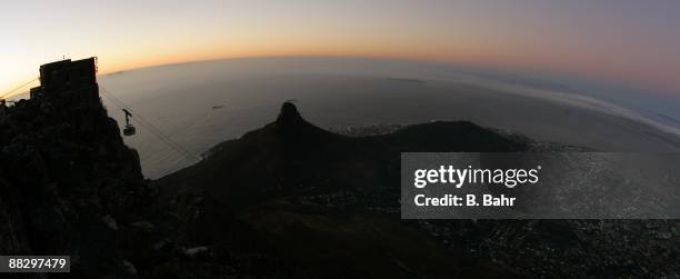 The cable car leading atop Table Mountain descends at dusk on March 15, 2009 in Cape Town, South Africa. South Africa will host the 2010 FIFA World...