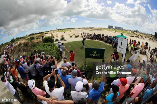 Tiger Woods of the United States plays his shot from the first tee during the first round of the Hero World Challenge at Albany, Bahamas on November...