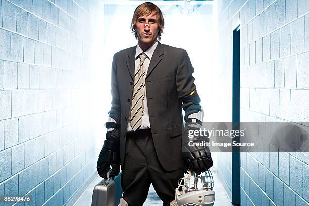 businessman with an ice hockey uniform - hockey helmet stock pictures, royalty-free photos & images