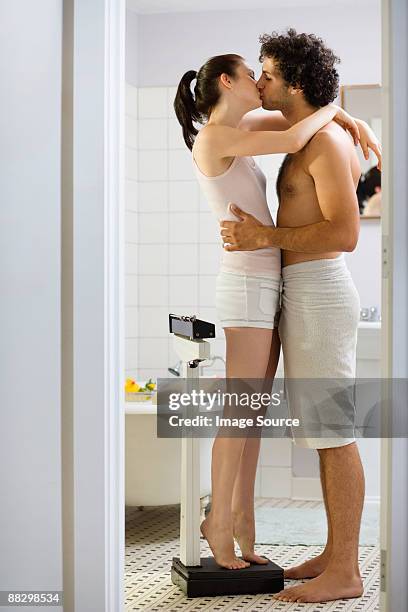 couple kissing in the bathroom - couple and kiss and bathroom stock-fotos und bilder