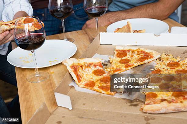 pizza on a table - greasy pizza box stock pictures, royalty-free photos & images