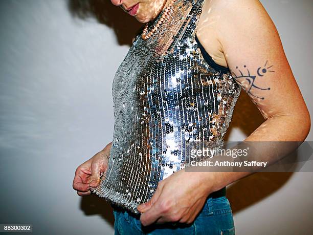 woman wearing sparkling sequined camisole - anthony saffery stock pictures, royalty-free photos & images