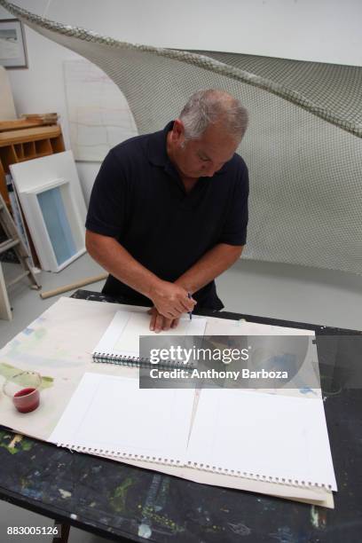 View of American artist Mike Solomon as he sketches in his Long Island studio, East Hampton, New York, August 10, 2011.