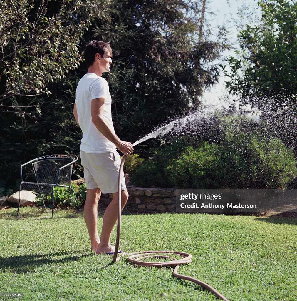 Man watering lawn