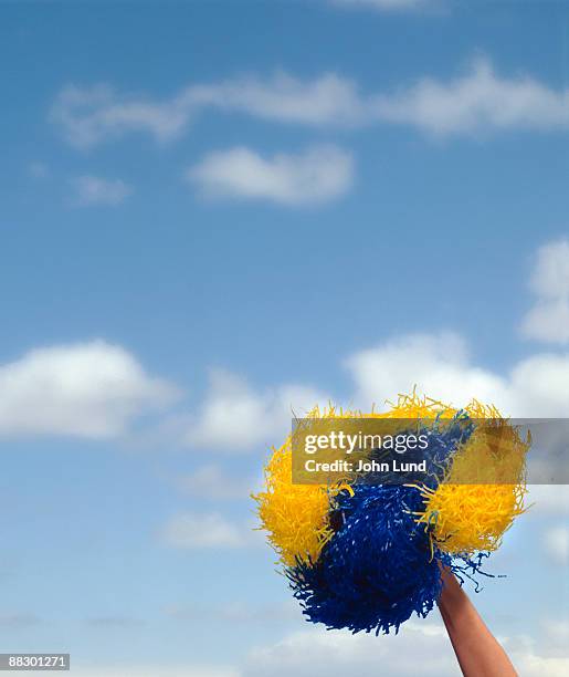 arm waving a pompom - pom pom stock pictures, royalty-free photos & images