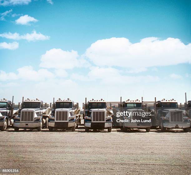 semi trucks parked - fleet of vehicles stock pictures, royalty-free photos & images