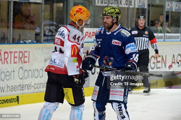 Jordan Owens of Bremerhaven and Jason Jaspers of Iserlohn Roosters look on during the DEL match between Iserlohn Roosters and Fischtown Pinguins...