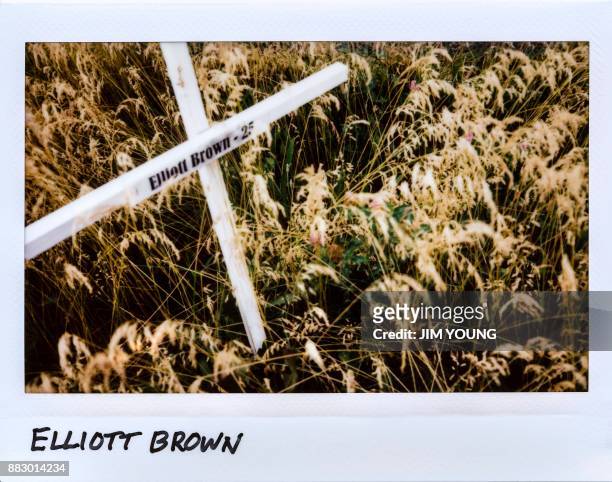 Cross is laid in honor of Elliott Brown, 25-year-old, in a field next to New Life Covenant Church in Chicago, Illinois on June 20, 2017. Brown was...