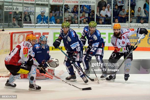 Jason Bast of Bremerhaven, Goalkeeper Mathias Lange of Iserlohn Roosters, Kevin Schmidt of Iserlohn Roosters, Dieter Orendorz of Iserlohn Roosters...