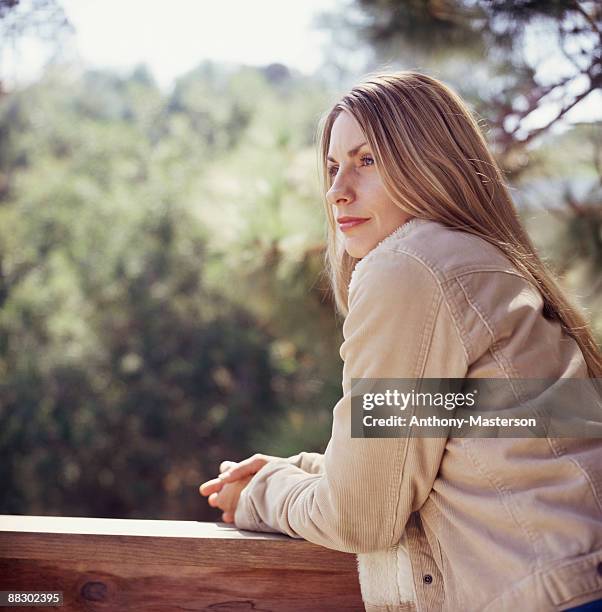 woman contemplating - anthony masterson stock-fotos und bilder