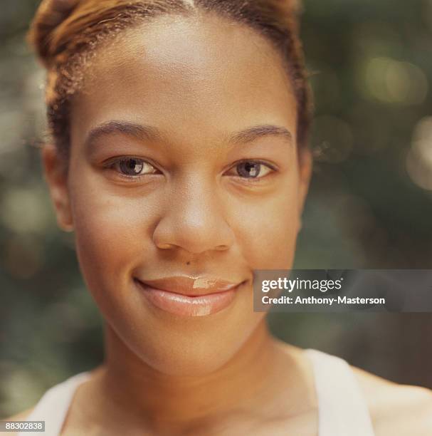 portrait of smiling woman - anthony masterson stock-fotos und bilder