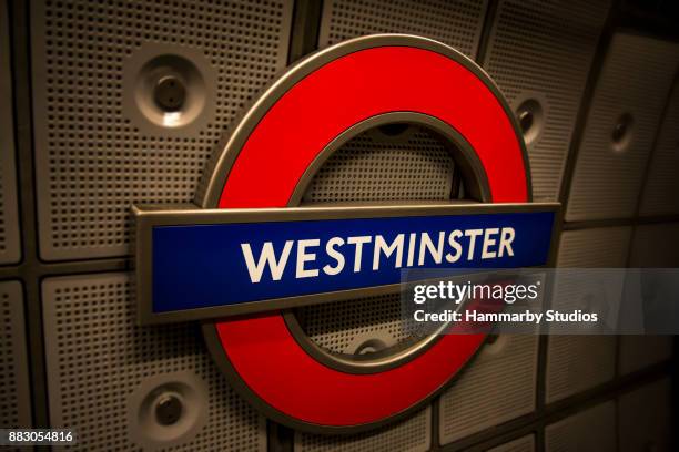 westminster subway (underground) sign in the westminster underground station in london, uk - roundel stock pictures, royalty-free photos & images