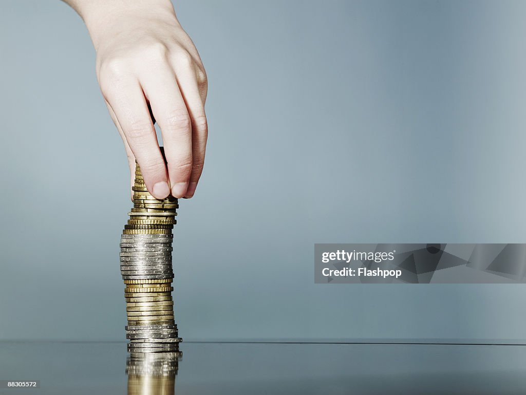 Hand with stack of coins