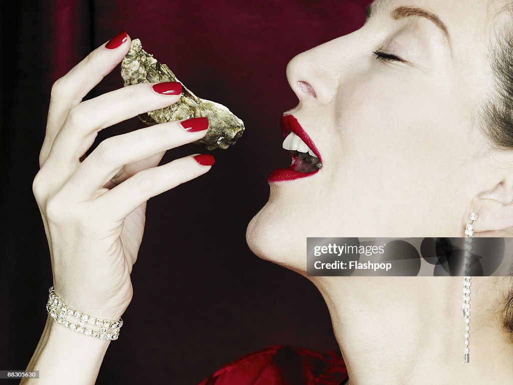 Woman eating an oyster