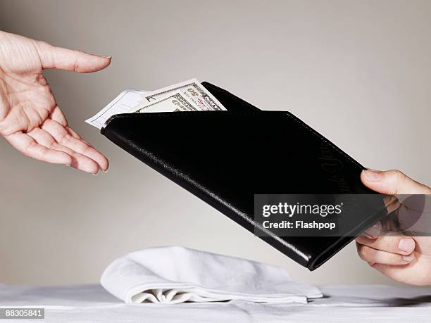 person paying waiter for restaurant bill - restaurant bill ストックフォトと画像