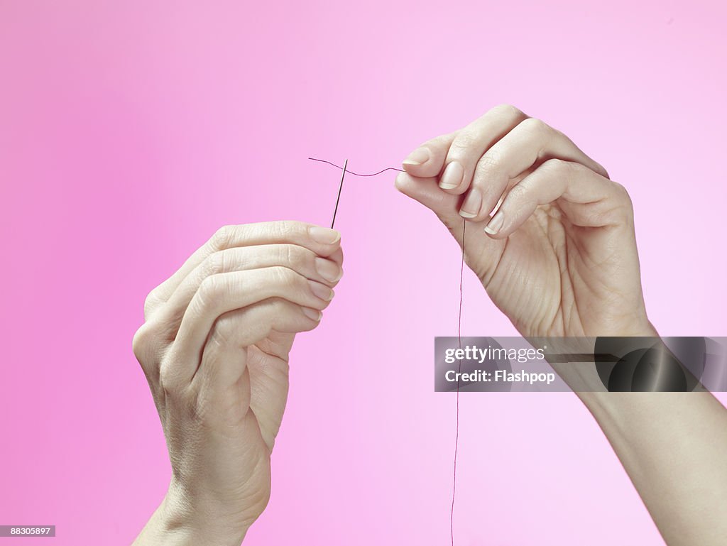 Hands Threading Sewing Needle High-Res Stock Photo - Getty Images