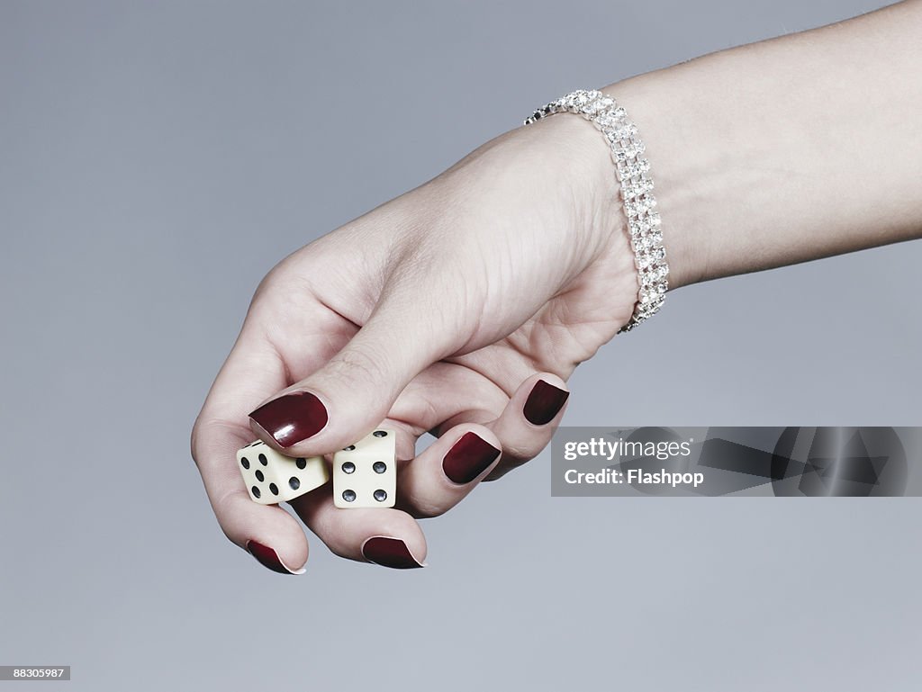 Hand holding dice