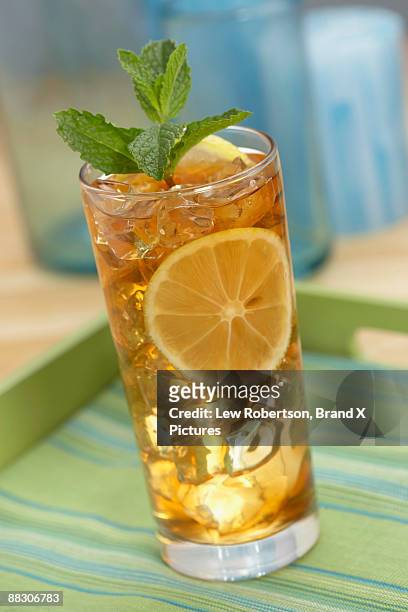 iced tea garnished with lemon and mint leaf - lemon leaf stock pictures, royalty-free photos & images