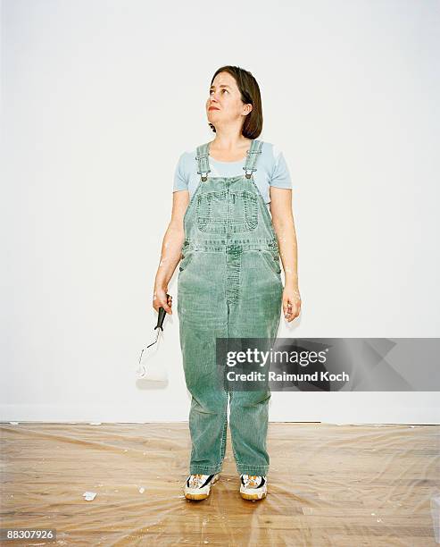 woman painting - tuinbroek stockfoto's en -beelden
