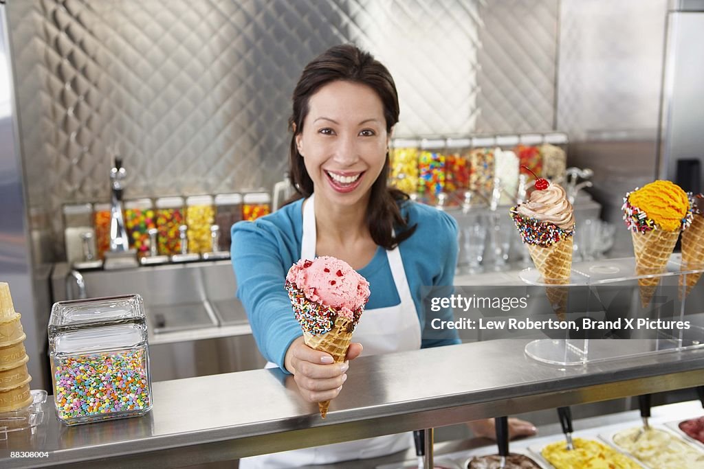 Woman working in ice cream parlor