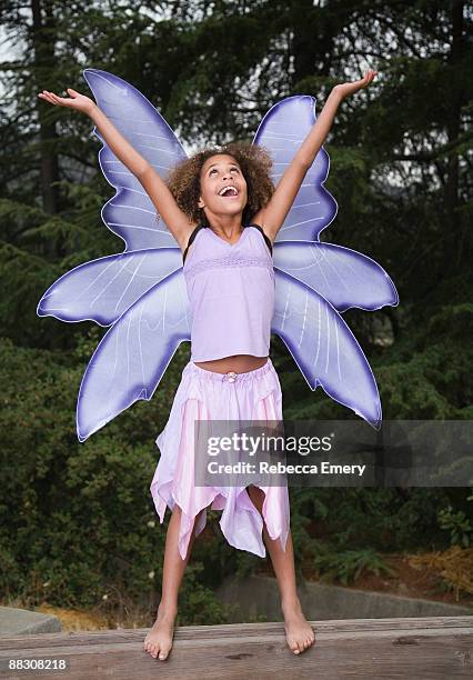 joyous girl in fairy costume - costume wing stock pictures, royalty-free photos & images