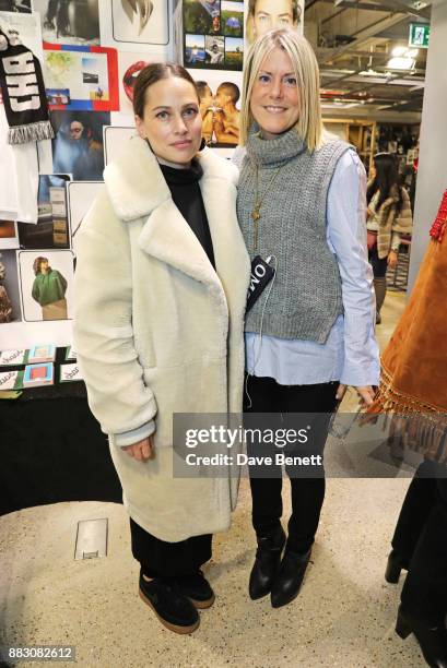 Anna Laub and Olivia McCall attend the Dover Street Market Holiday Open House on November 30, 2017 in London, England.