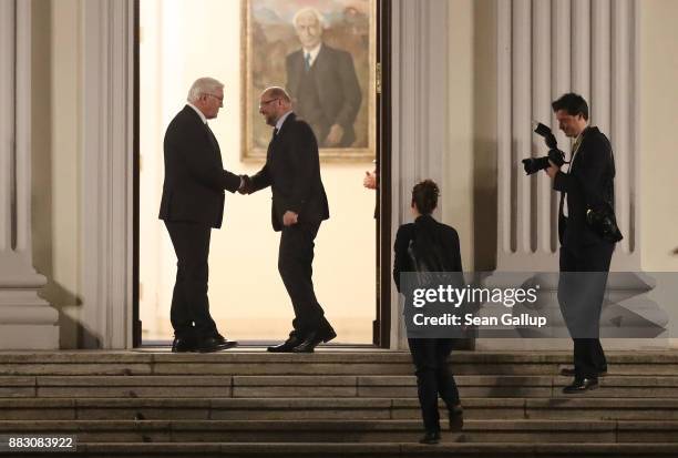 German President Frank-Walter Steinmeier greets Martin Schulz, leader of the German Social Democrats , as Schulz arrives for a meeting of the SPD,...