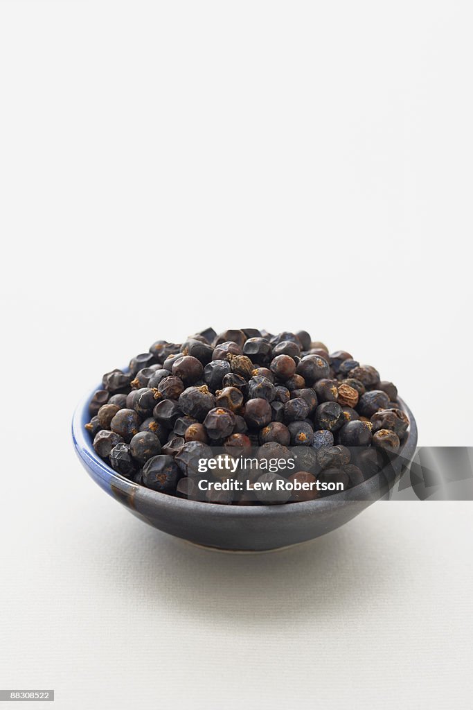 Dried juniper berries in bowl