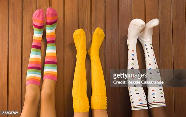 pre-teen girls wearing colorful socks - knee length stock-fotos und bilder