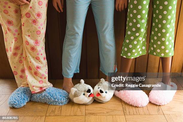 pre-teen girls wearing fuzzy slippers - pajamas stock pictures, royalty-free photos & images