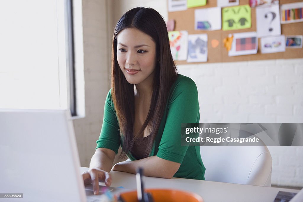 Businesswoman looking at laptop computer