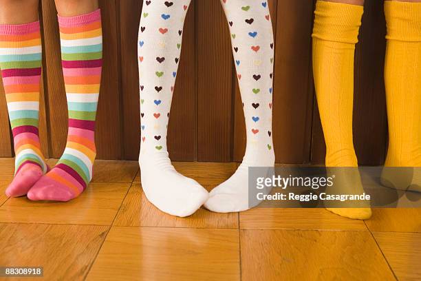 pre-teen girls wearing colorful socks - knee length stock pictures, royalty-free photos & images