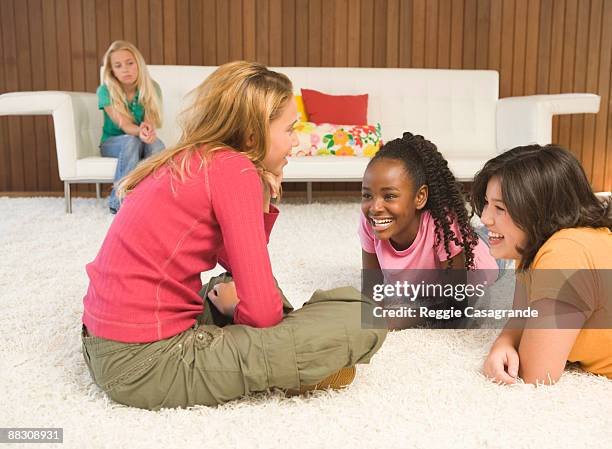 pre-teen girls lying on floor talking - ostracized stock pictures, royalty-free photos & images