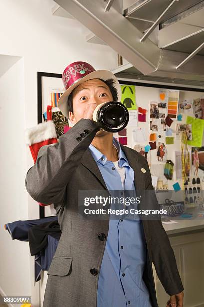 man in office celebrating new year's eve party - men of the year party inside stock pictures, royalty-free photos & images