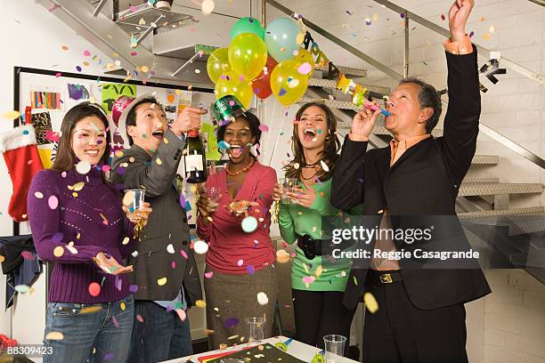 co-workers in office having a new year's eve party - honour board stock pictures, royalty-free photos & images