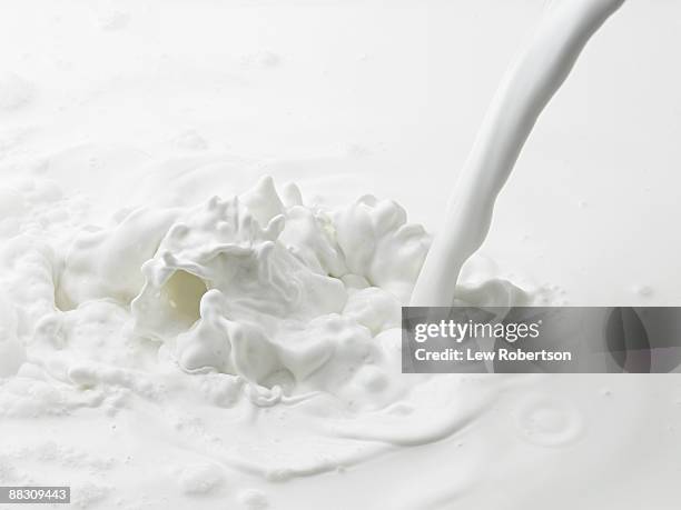 milk pouring - cream splash stock pictures, royalty-free photos & images