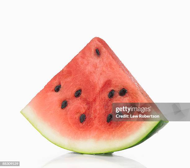 slice of watermelon with seeds - watermelon fotografías e imágenes de stock