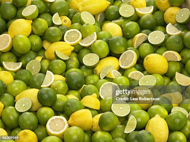 lime and lemon background - limes stock pictures, royalty-free photos & images
