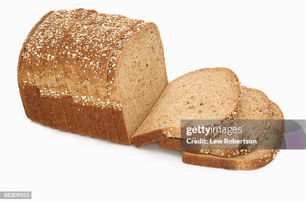 loaf of multi-grain bread - slice of bread stock pictures, royalty-free photos & images