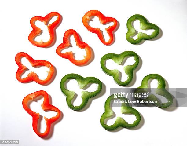 red and green bell pepper rings - capsicum stock pictures, royalty-free photos & images