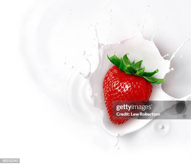 strawberry and milk splash - cream splash stock pictures, royalty-free photos & images