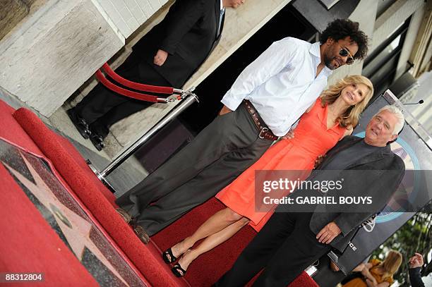 Actress Kyra Sedgwick poses with Producer Lee Daniels and "The Closer" cast member G.W.Bailey after being honored by a star on the Hollywood Walk of...