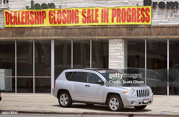 Jeep sits in front of the empty showroom at Premier Chrysler June 8, 2009 in Chicago, Illinois. The dealership is 1 of the 789 Chrysler dealerships...