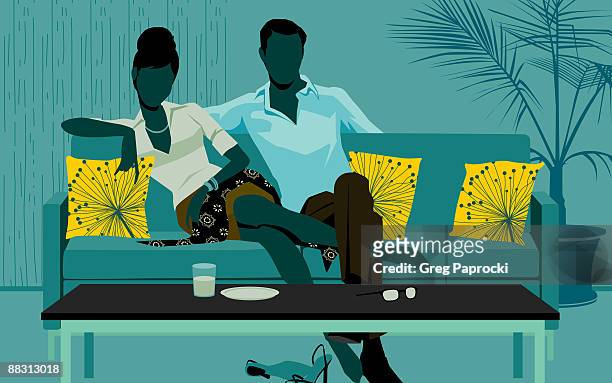 stockillustraties, clipart, cartoons en iconen met man and woman sitting on sofa - watching television