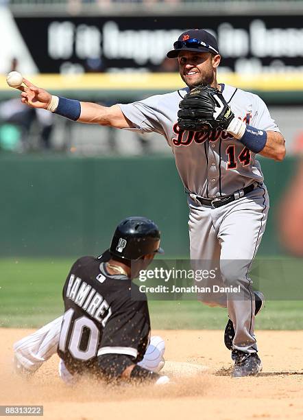 Placido Polanco of the Detroit Tigers turns a game-ending double play, forcing Alexei Ramirez of the Chicago White Sox on June 8, 2009 at U.S....