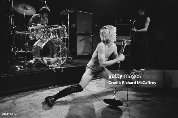 Scott Asheton, Iggy Pop and James Williamson of The Stooges perform live at Bimbo's Club in 1974 in San Francisco, California.