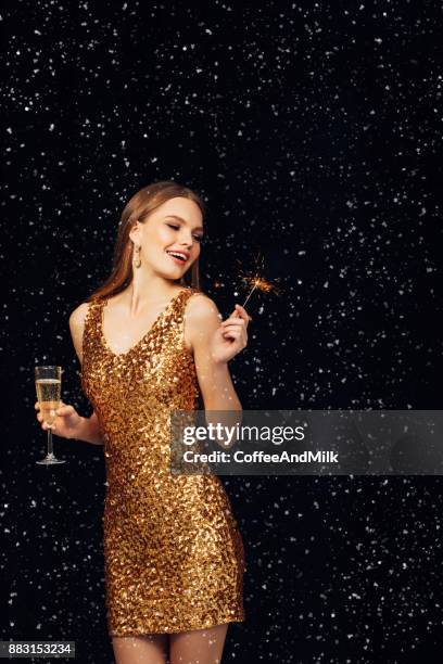 beautiful woman wearing golden dress - champagne flute milk stock pictures, royalty-free photos & images